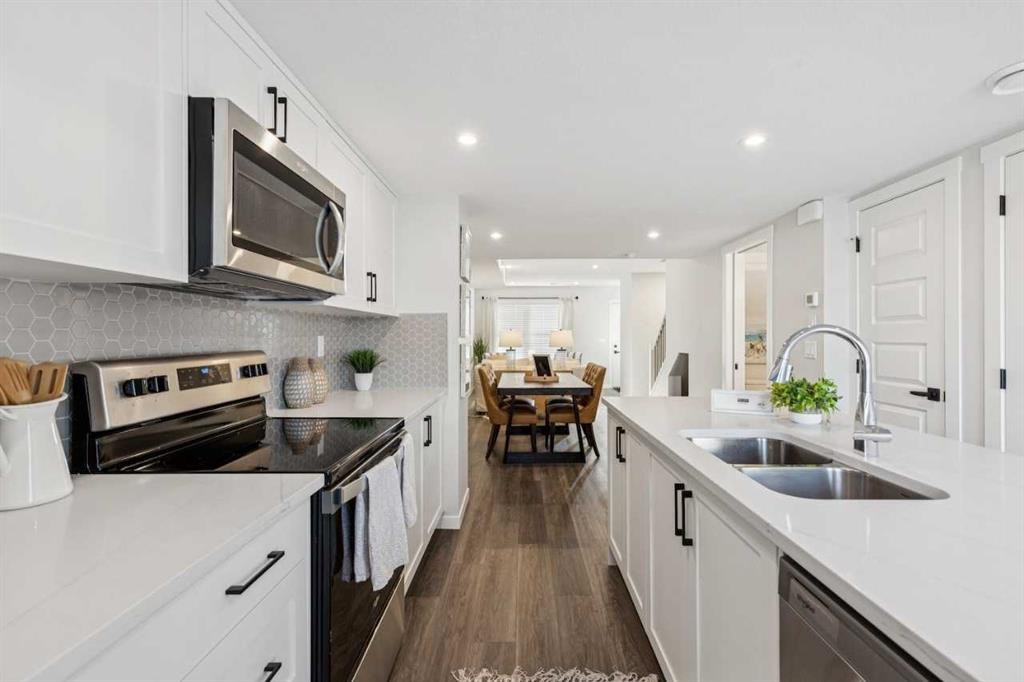 107-135 Mahogany Parade Se, Calgary, AB - Indoor Photo Showing Kitchen With Double Sink With Upgraded Kitchen