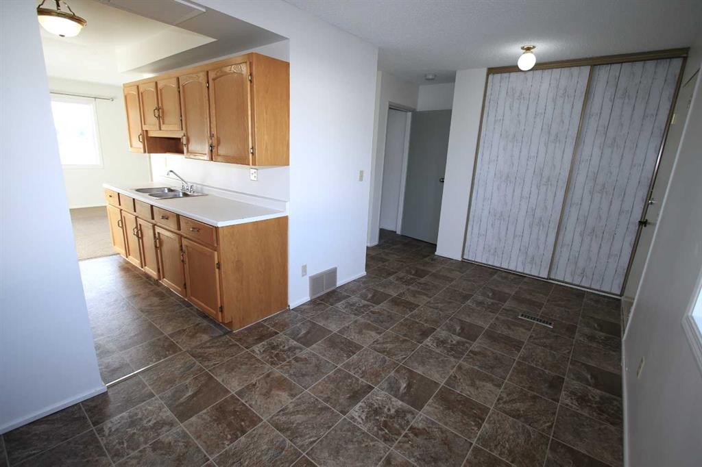 44-7124 Gray Drive, Red Deer, AB - Indoor Photo Showing Kitchen With Double Sink