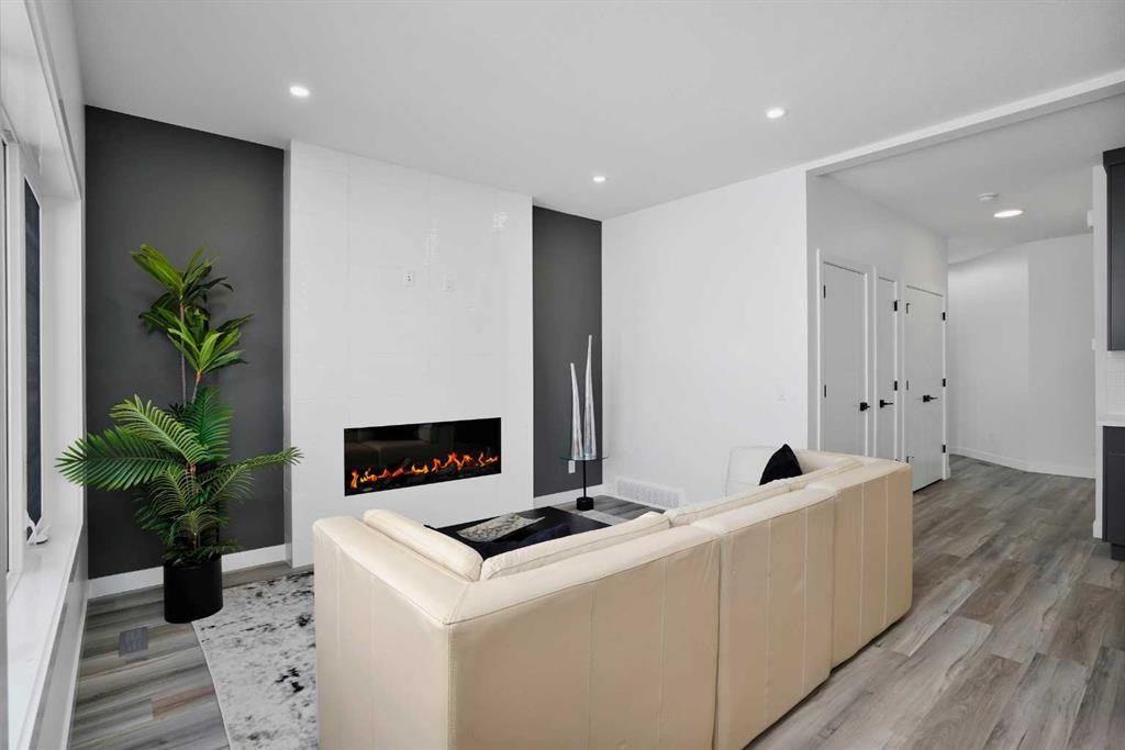 18 Palmer Circle, Blackfalds, AB - Indoor Photo Showing Other Room With Fireplace