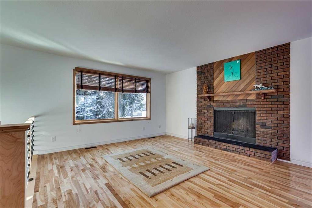 8 Nielsen Close, Red Deer, AB - Indoor Photo Showing Living Room With Fireplace