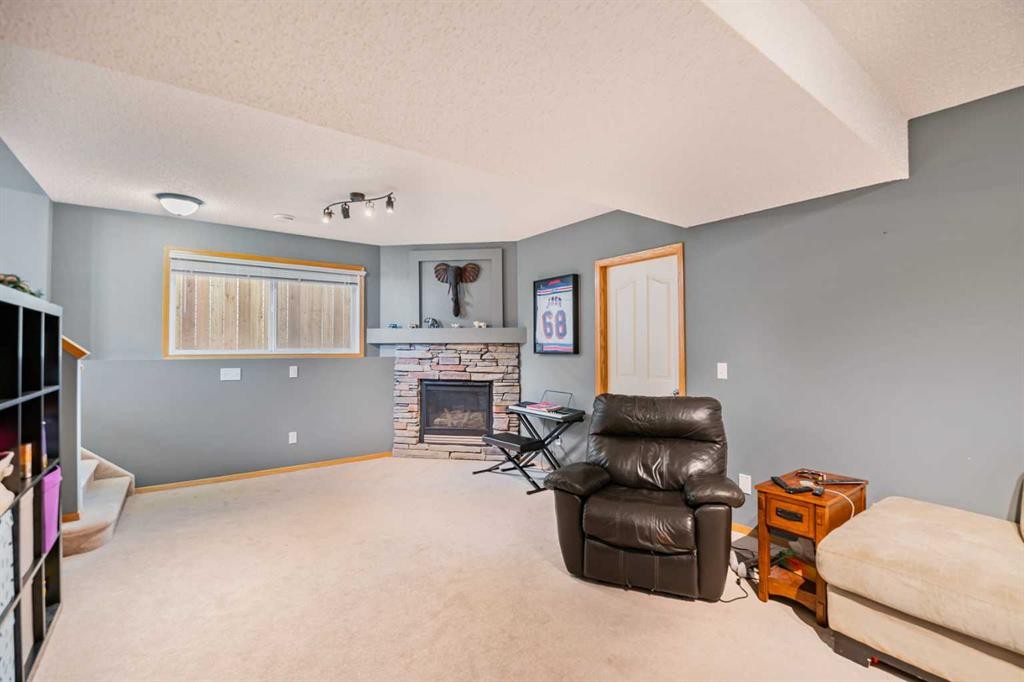 27 Jacobs Close, Red Deer, AB - Indoor With Fireplace