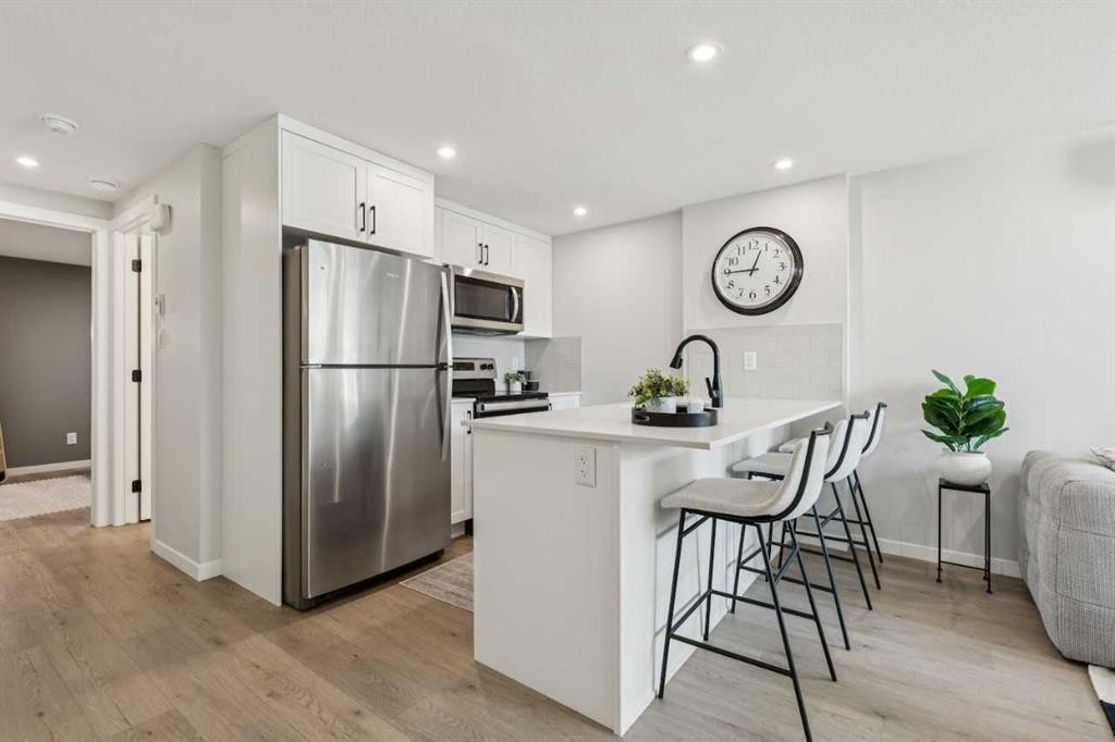 201-135 Mahogany Parade Se, Calgary, AB - Indoor Photo Showing Kitchen With Upgraded Kitchen