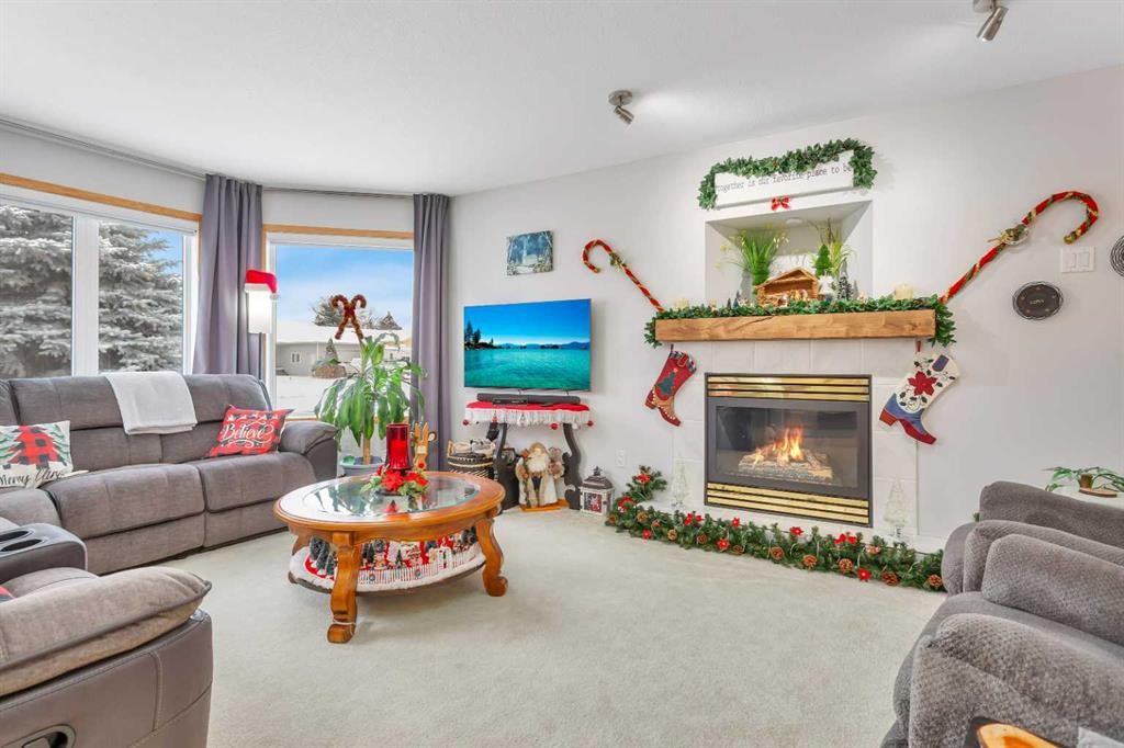 5233 45 Avenue, Rimbey, AB - Indoor Photo Showing Living Room With Fireplace