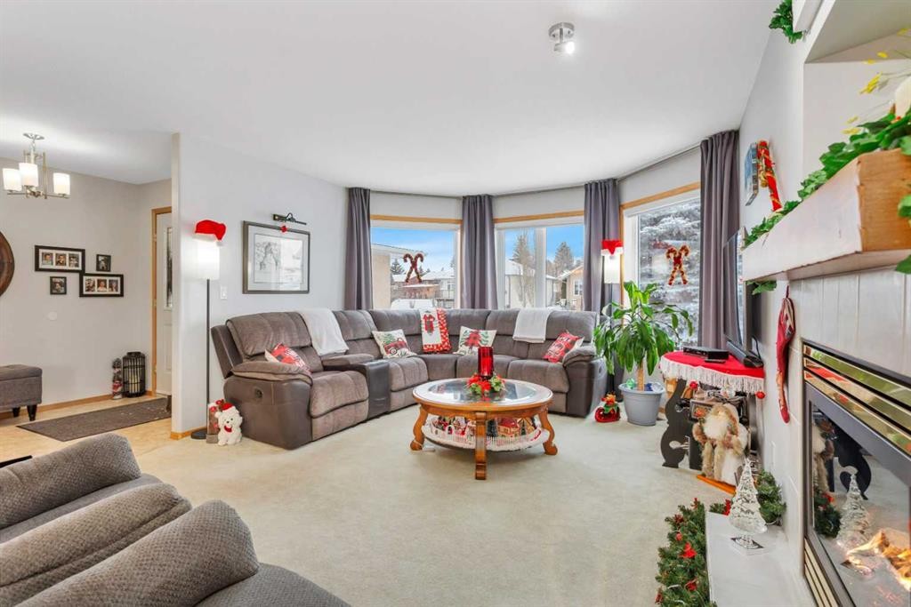 5233 45 Avenue, Rimbey, AB - Indoor Photo Showing Living Room With Fireplace