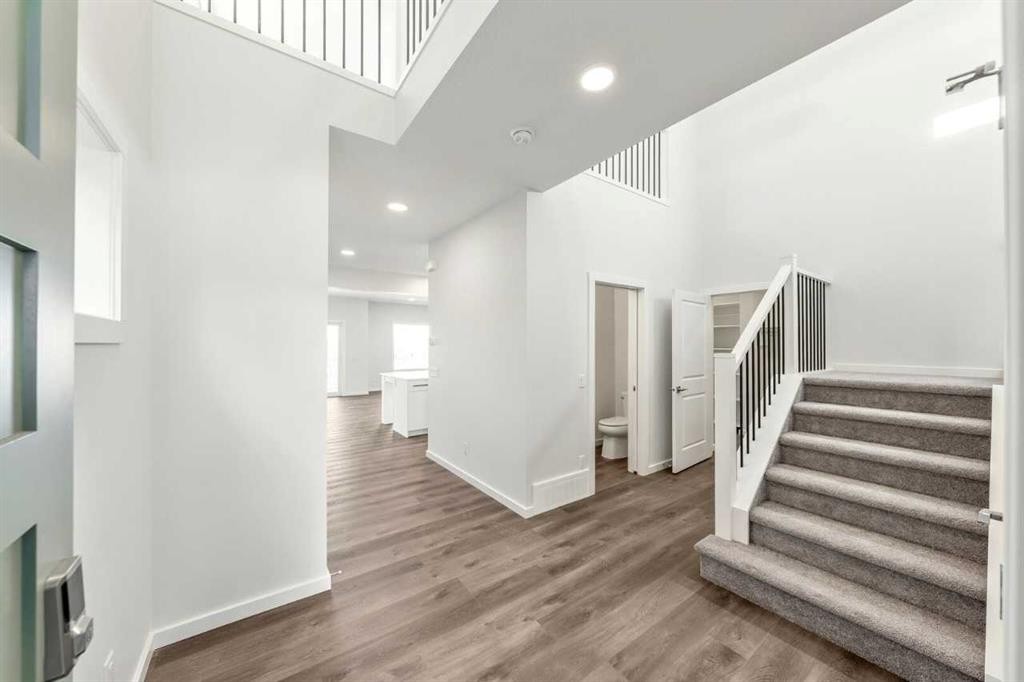 8 Heritage Link, Cochrane, AB - Indoor Photo Showing Other Room