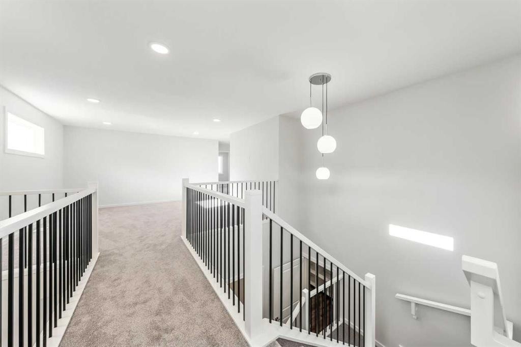 8 Heritage Link, Cochrane, AB - Indoor Photo Showing Other Room