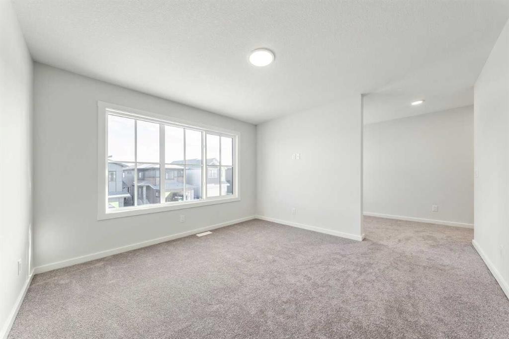8 Heritage Link, Cochrane, AB - Indoor Photo Showing Other Room