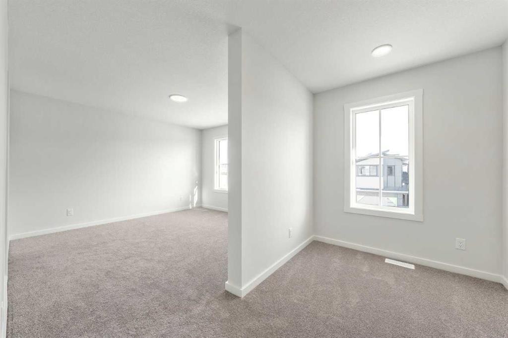 8 Heritage Link, Cochrane, AB - Indoor Photo Showing Other Room
