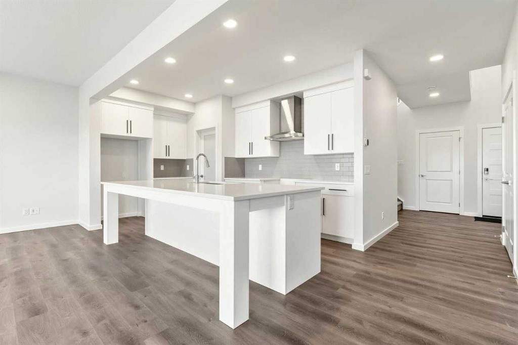 8 Heritage Link, Cochrane, AB - Indoor Photo Showing Kitchen With Upgraded Kitchen