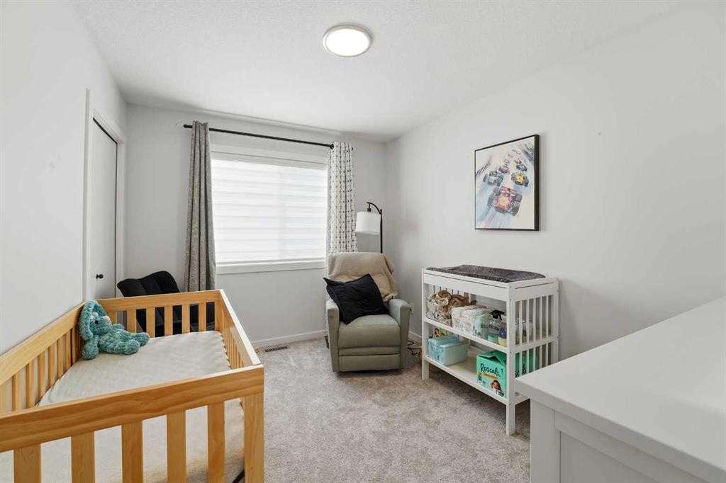 51 Lake Street, Rural Red Deer County, AB - Indoor Photo Showing Bedroom