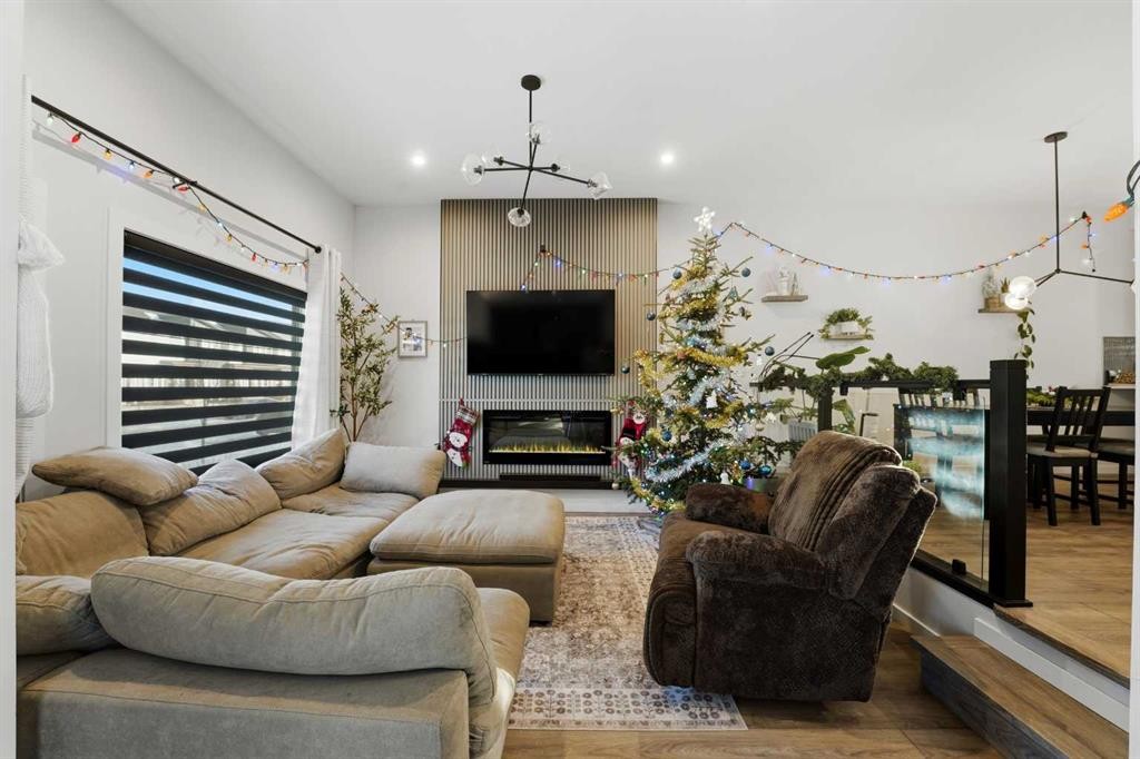51 Lake Street, Rural Red Deer County, AB - Indoor Photo Showing Living Room With Fireplace