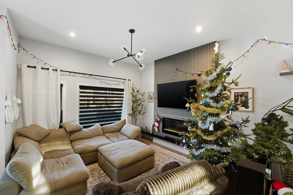 51 Lake Street, Rural Red Deer County, AB - Indoor Photo Showing Living Room With Fireplace