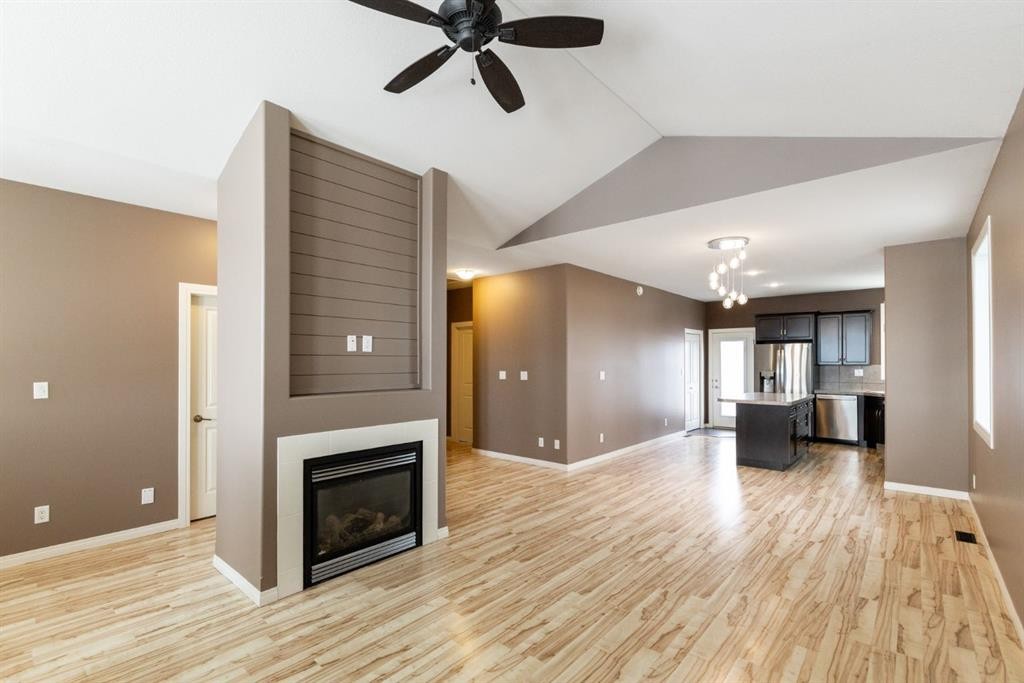 6321 58 Avenue, Innisfail, AB - Indoor Photo Showing Living Room With Fireplace