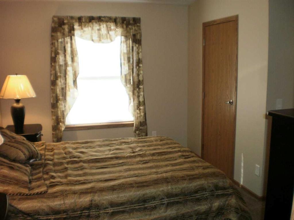 23 Cherry Lane Se, Three Hills, AB - Indoor Photo Showing Bedroom