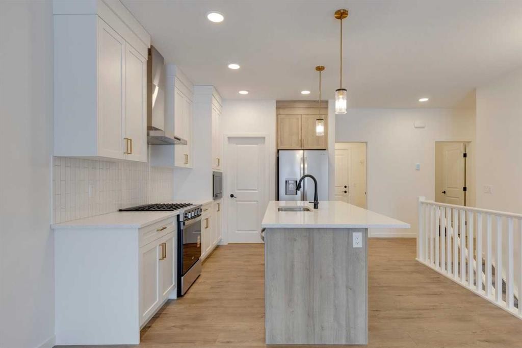 1402 Bayview Crescent Sw, Airdrie, AB - Indoor Photo Showing Kitchen With Upgraded Kitchen