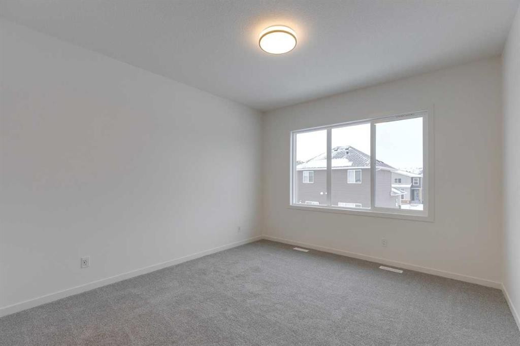 1402 Bayview Crescent Sw, Airdrie, AB - Indoor Photo Showing Other Room