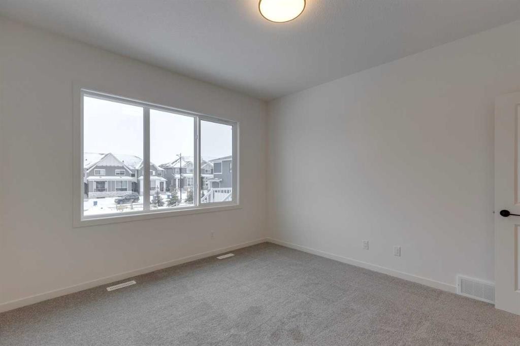 1402 Bayview Crescent Sw, Airdrie, AB - Indoor Photo Showing Other Room