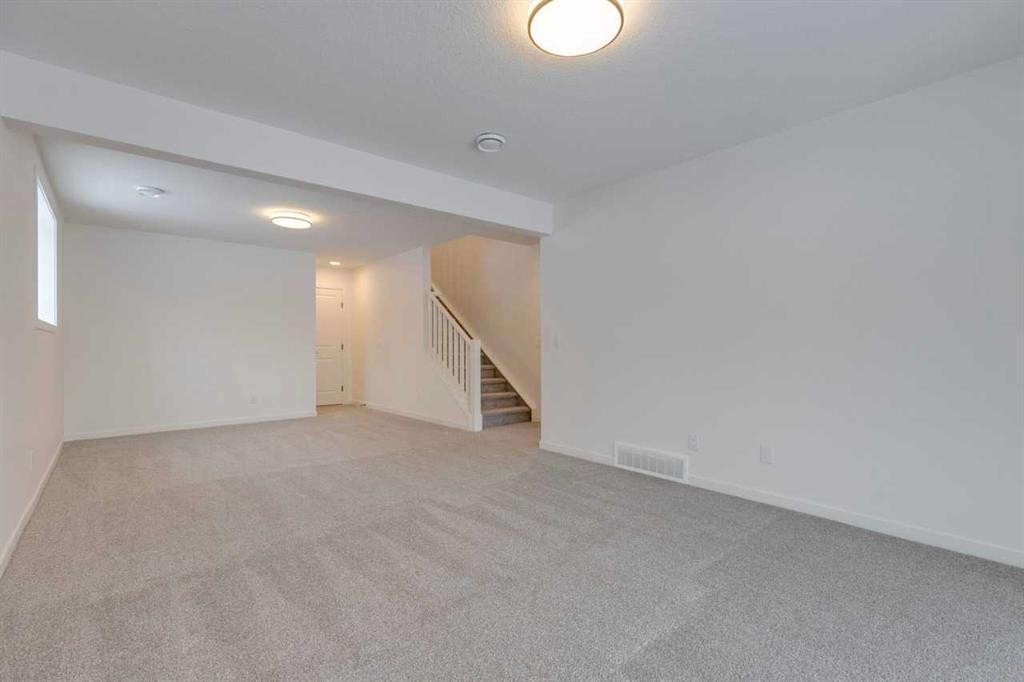 1402 Bayview Crescent Sw, Airdrie, AB - Indoor Photo Showing Other Room