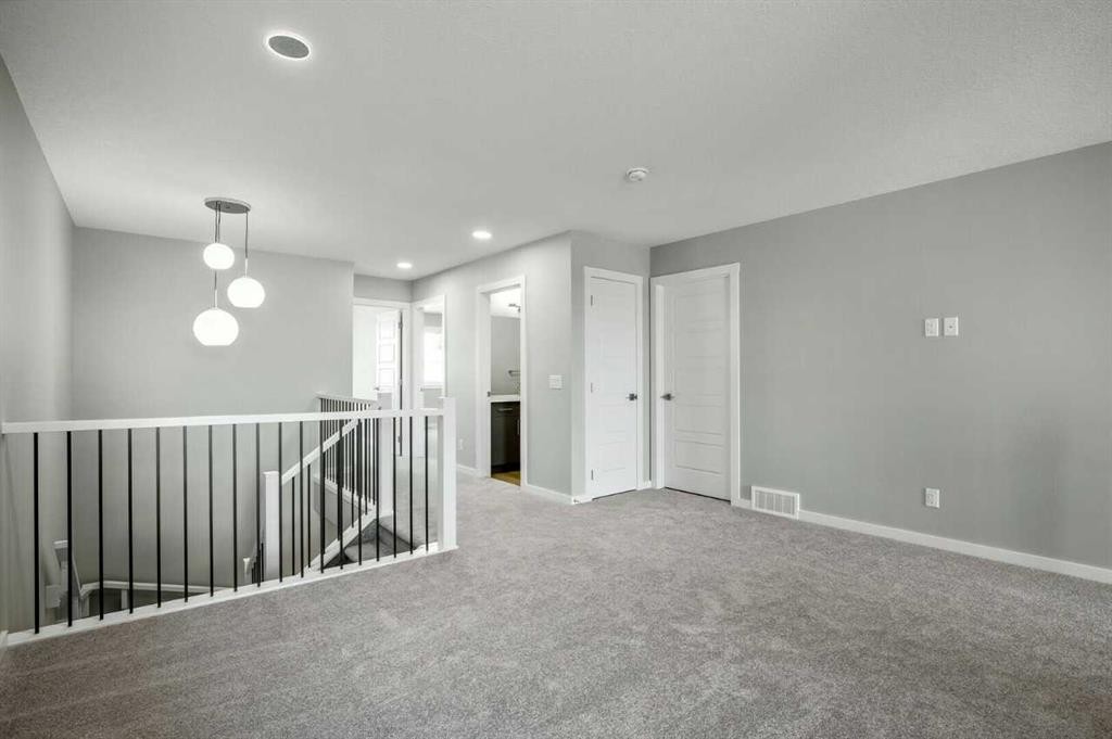 11 Heritage Link, Cochrane, AB - Indoor Photo Showing Other Room