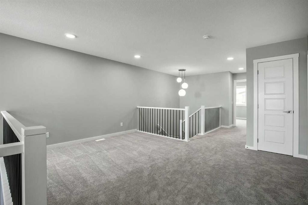 11 Heritage Link, Cochrane, AB - Indoor Photo Showing Other Room