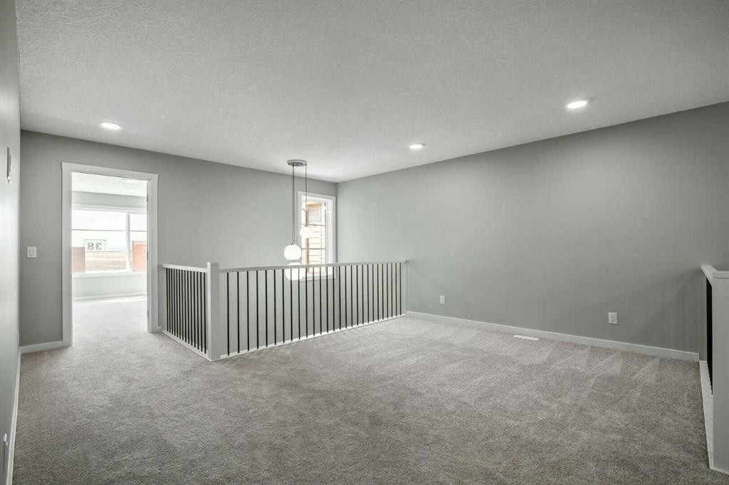 11 Heritage Link, Cochrane, AB - Indoor Photo Showing Other Room