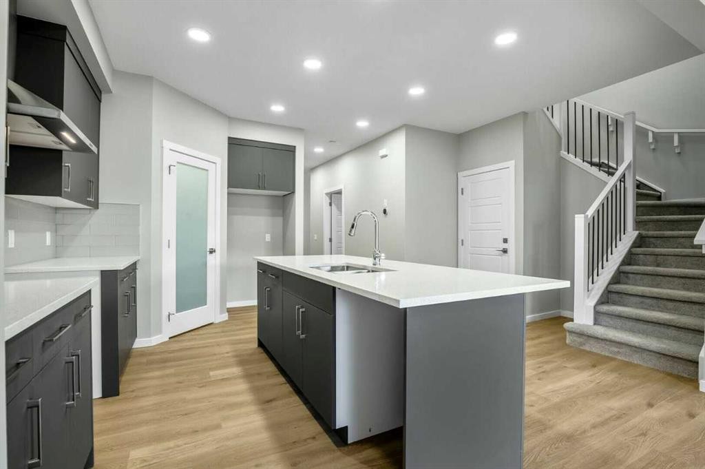 11 Heritage Link, Cochrane, AB - Indoor Photo Showing Kitchen With Upgraded Kitchen