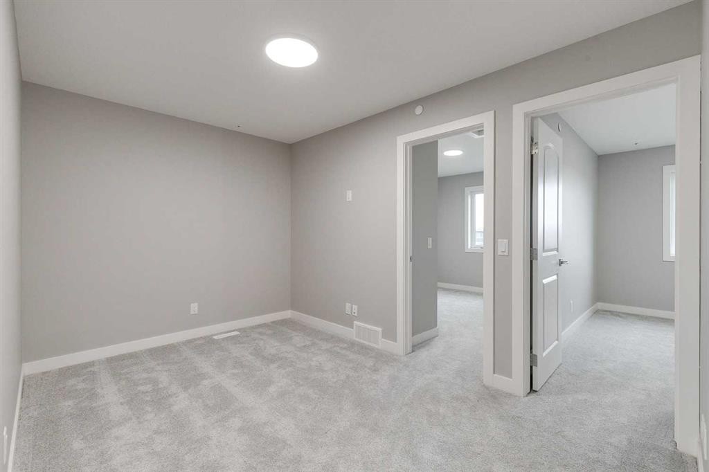 483 Hotchkiss Manor Se, Calgary, AB - Indoor Photo Showing Other Room