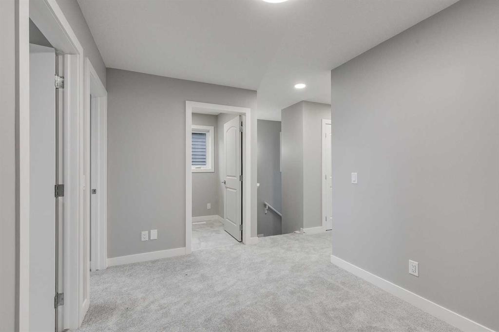 483 Hotchkiss Manor Se, Calgary, AB - Indoor Photo Showing Other Room