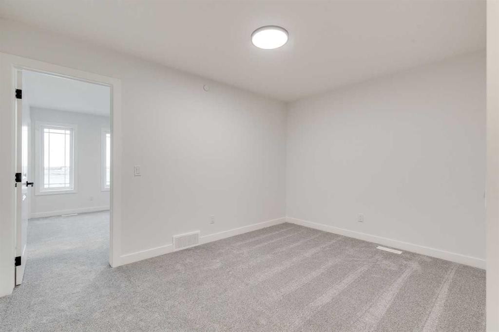 479 Hotchkiss Manor Se, Calgary, AB - Indoor Photo Showing Other Room
