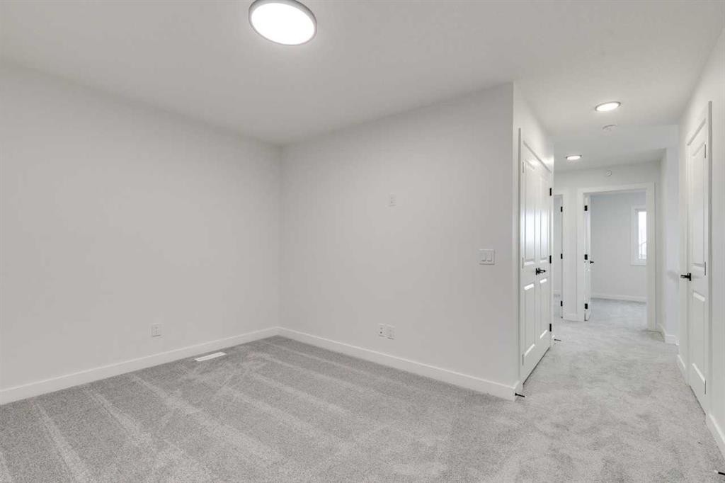 479 Hotchkiss Manor Se, Calgary, AB - Indoor Photo Showing Other Room