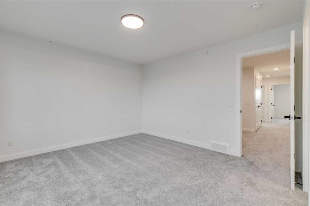 479 Hotchkiss Manor Se, Calgary, AB - Indoor Photo Showing Other Room