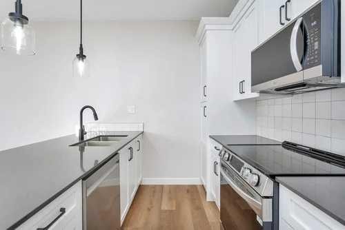 46 Concord Rise, Sylvan Lake, AB - Indoor Photo Showing Kitchen With Double Sink With Upgraded Kitchen