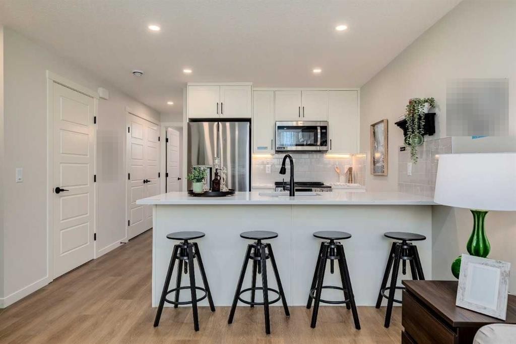 105-40 Livingston Parade Ne, Calgary, AB - Indoor Photo Showing Kitchen With Upgraded Kitchen