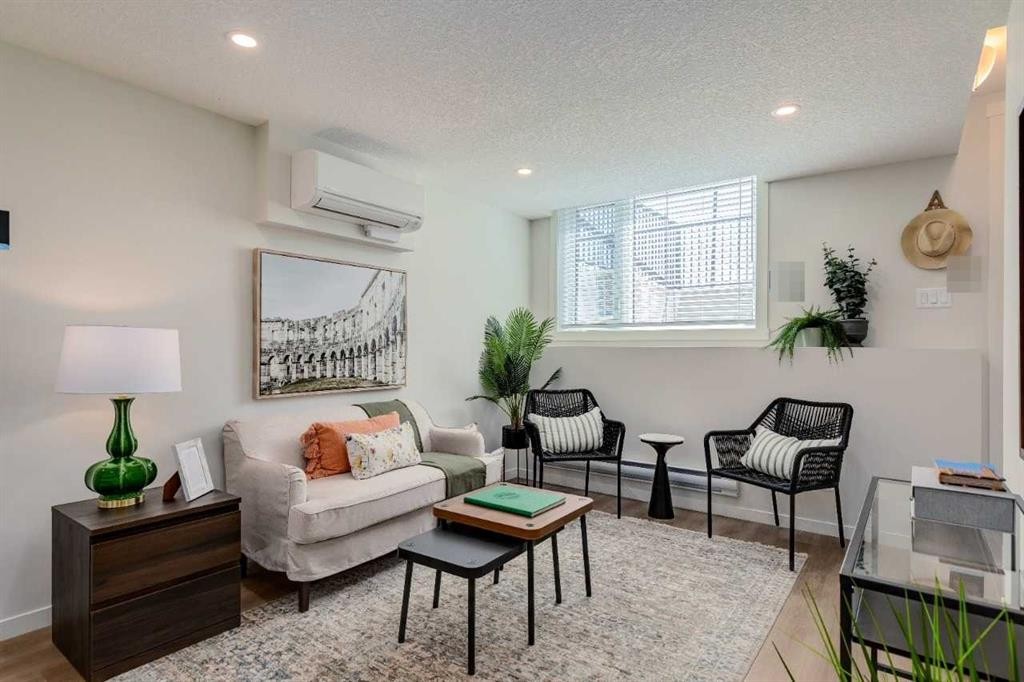 105-40 Livingston Parade Ne, Calgary, AB - Indoor Photo Showing Living Room