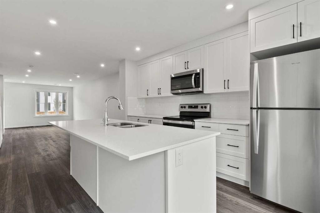 106-40 Livingston Parade Ne, Calgary, AB - Indoor Photo Showing Kitchen With Double Sink With Upgraded Kitchen