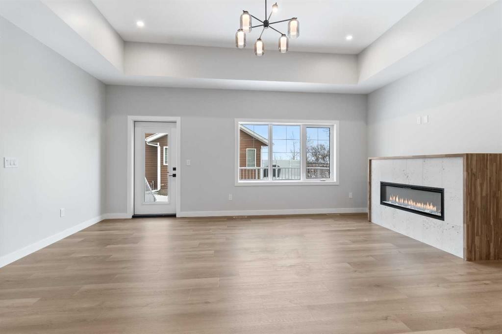 4924 Beardsley Avenue, Lacombe, AB - Indoor Photo Showing Other Room With Fireplace