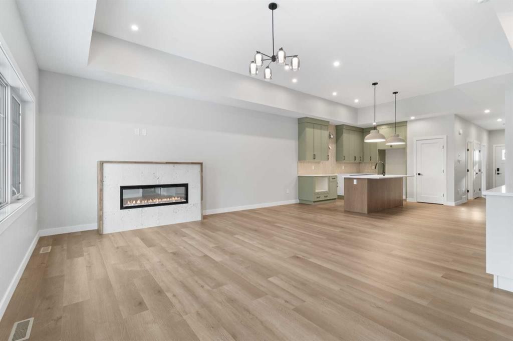 4924 Beardsley Avenue, Lacombe, AB - Indoor Photo Showing Living Room With Fireplace