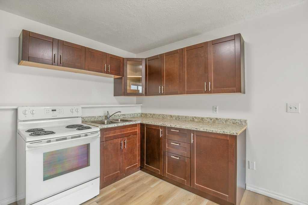 52 Harper Drive, Sylvan Lake, AB - Indoor Photo Showing Kitchen With Double Sink