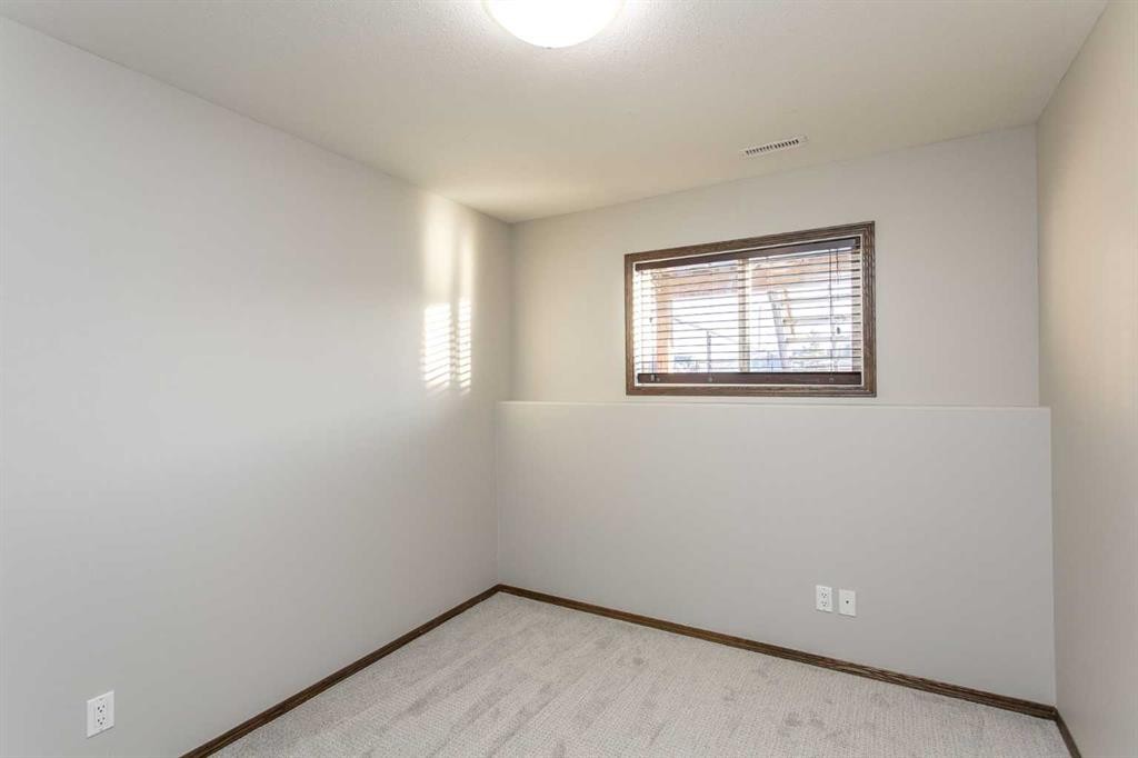 92 Iron Wolf Boulevard, Lacombe, AB - Indoor Photo Showing Other Room