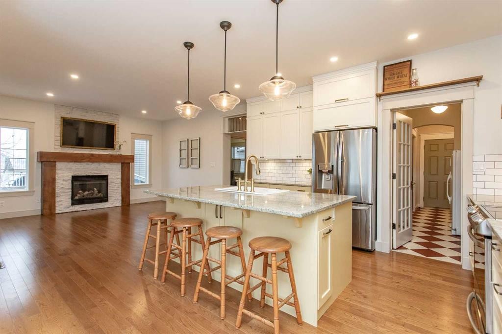 32 Carter Close, Red Deer, AB - Indoor Photo Showing Kitchen With Fireplace With Upgraded Kitchen