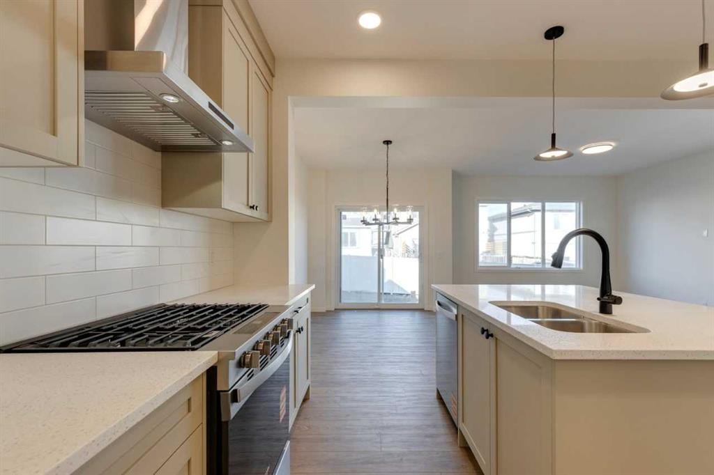 1419 Bayview Crescent Sw, Airdrie, AB - Indoor Photo Showing Kitchen With Double Sink With Upgraded Kitchen