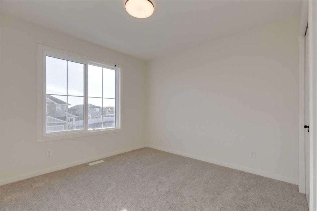 1419 Bayview Crescent Sw, Airdrie, AB - Indoor Photo Showing Other Room