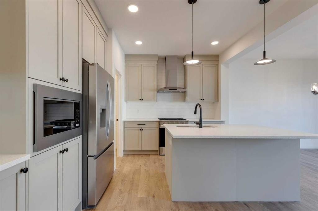 1419 Bayview Crescent Sw, Airdrie, AB - Indoor Photo Showing Kitchen With Upgraded Kitchen