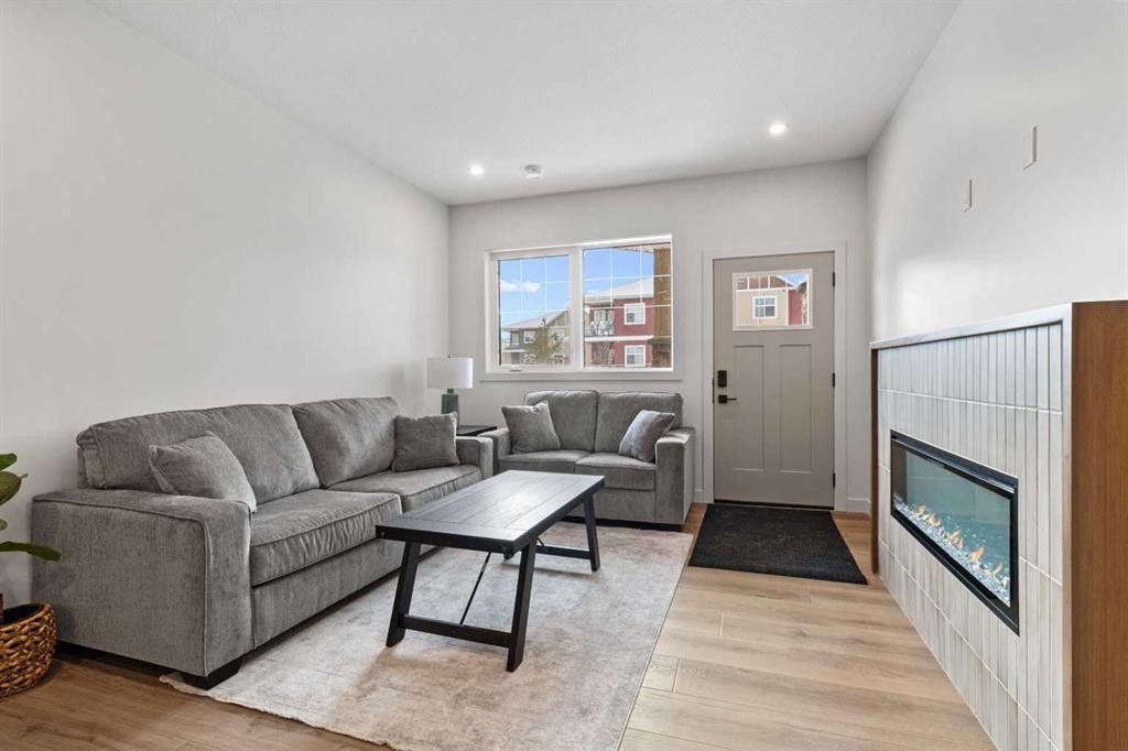 4940 Beardsley Avenue, Lacombe, AB - Indoor Photo Showing Living Room With Fireplace