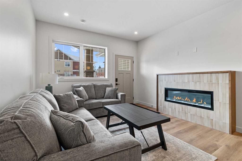 4940 Beardsley Avenue, Lacombe, AB - Indoor Photo Showing Living Room With Fireplace