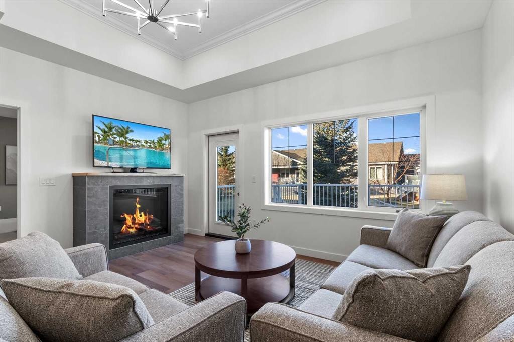 4930 Beardsley Avenue, Lacombe, AB - Indoor Photo Showing Living Room With Fireplace