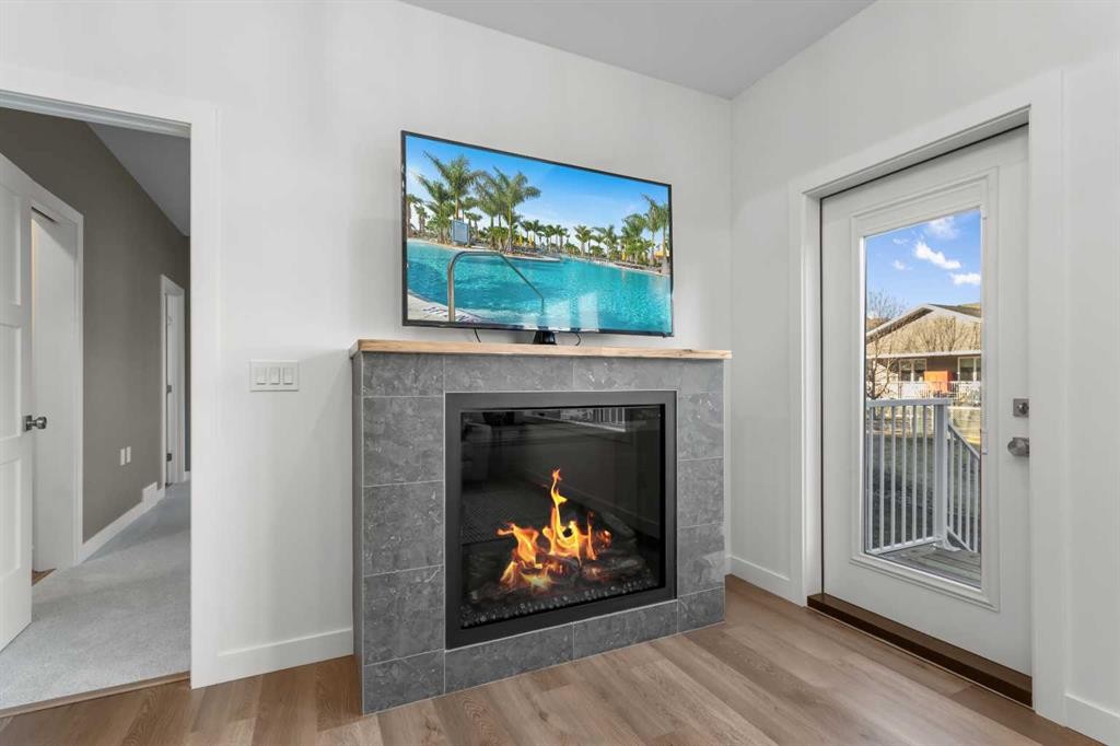 4930 Beardsley Avenue, Lacombe, AB - Indoor Photo Showing Living Room With Fireplace