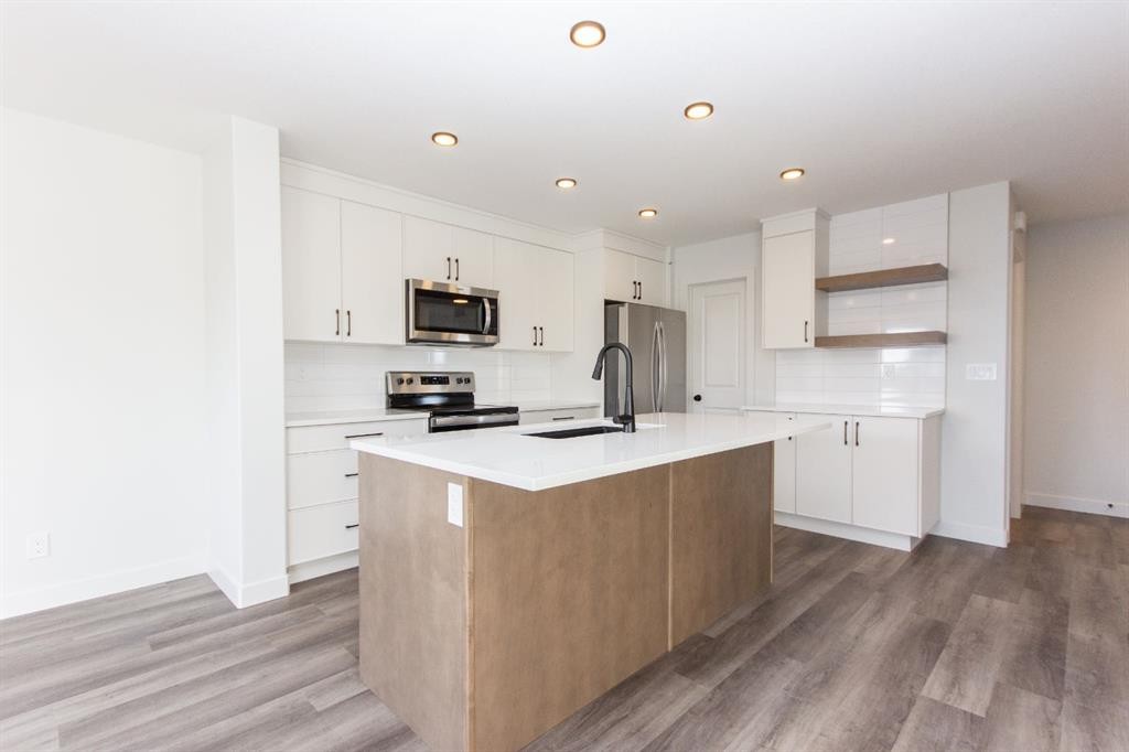 17 Trinity Street, Lacombe, AB - Indoor Photo Showing Kitchen With Stainless Steel Kitchen With Upgraded Kitchen