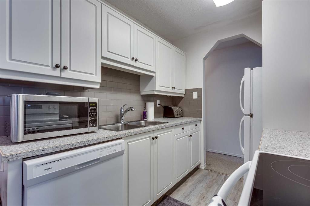 3-5 Stanton Street, Red Deer, AB - Indoor Photo Showing Kitchen With Double Sink