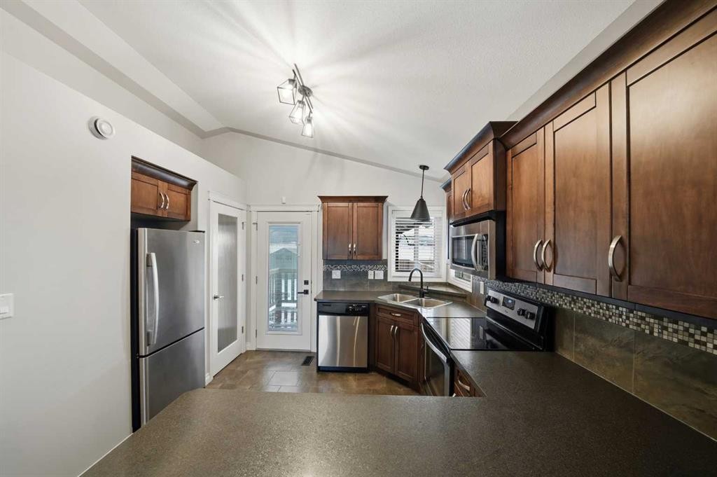 69 Bowman Circle, Sylvan Lake, AB - Indoor Photo Showing Kitchen With Stainless Steel Kitchen With Double Sink